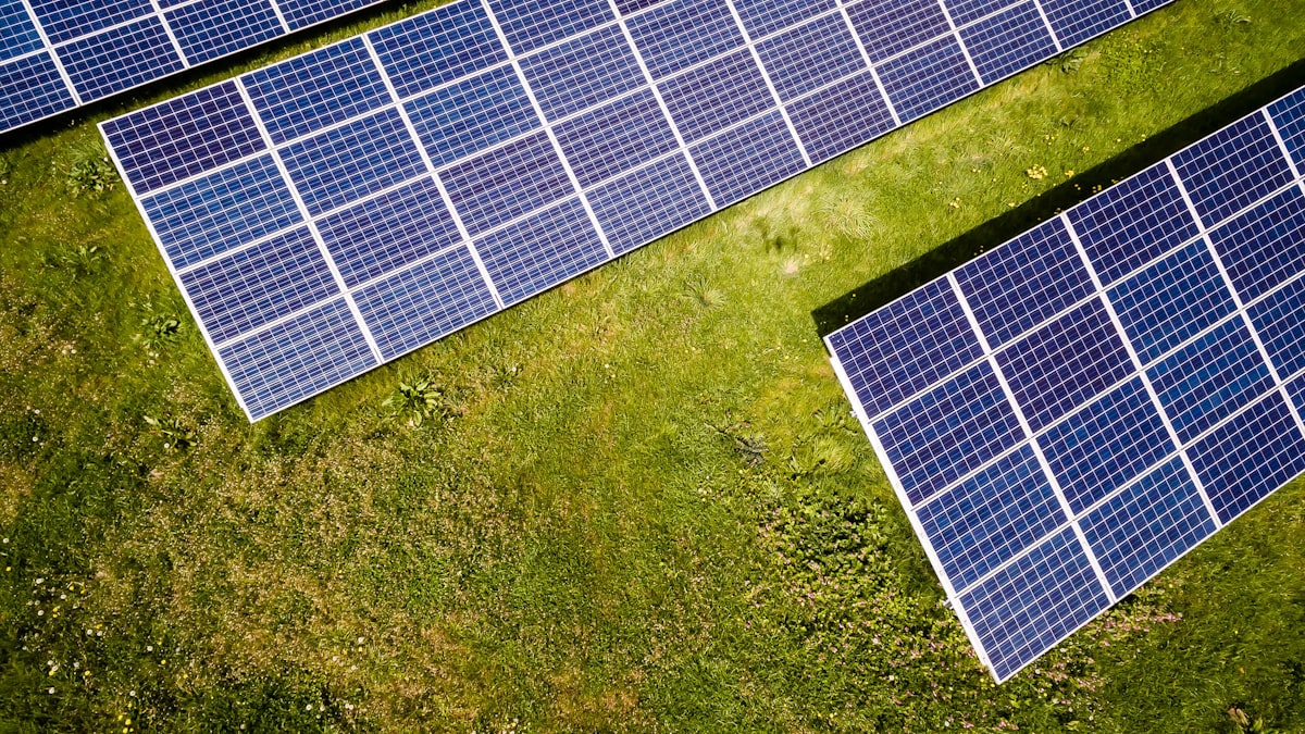 Aerial view of solar panels installed in a green Maryland field